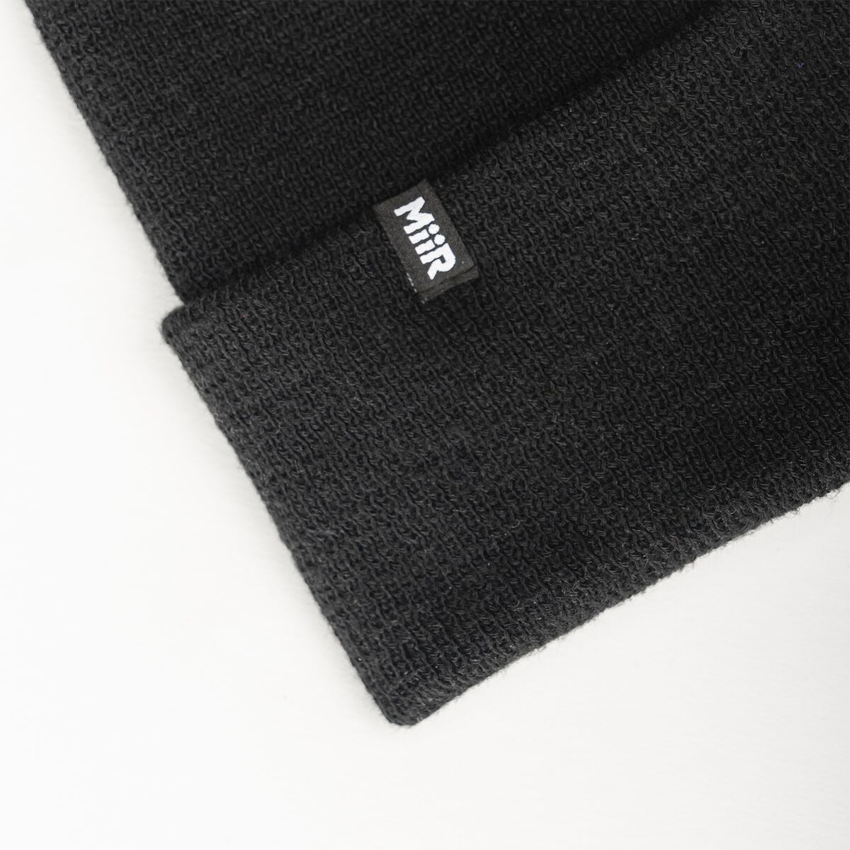 recycled-poly-fine-knit-beanie-t3 WebPDP-RecycledPolyFineKnitBeanie_Studio_TagDetail_Black__BNE005002OS.jpg