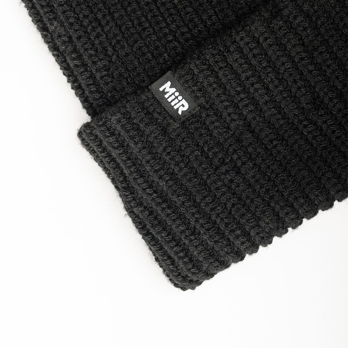 recycled-poly-rib-beanie-i3 WebPDP-RecycledPolyRibBeanie_Studio_TagDetail_Black__BNE002002OS.jpg